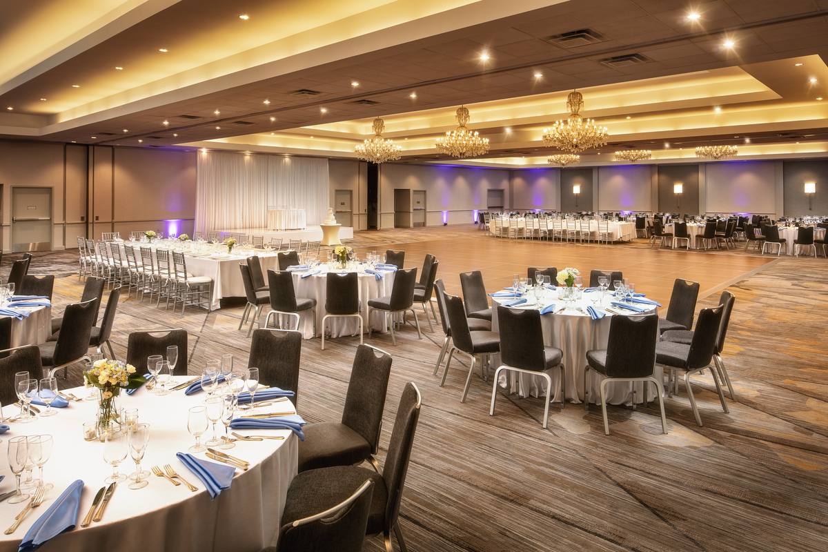 The Dolce Parsippany ballroom set for a banquet, with chandeliers and a dance floor