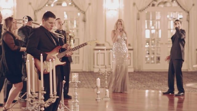 Daddy Pop performing in an elegant ballroom