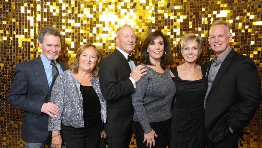 Guests in evening wear at a past gala