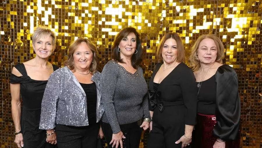 Five friends in black and silver at a past gala